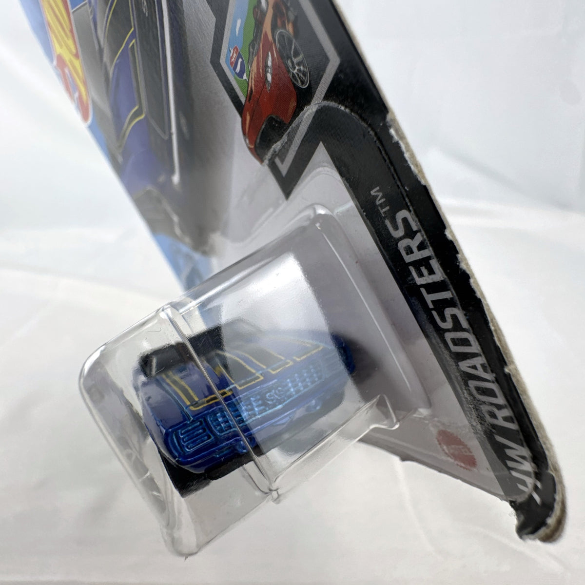 Hot Wheels 1:64 scale 1969 Chevrolet Camaro SS Convertible in deep blue with black and gold racing stripes on original card