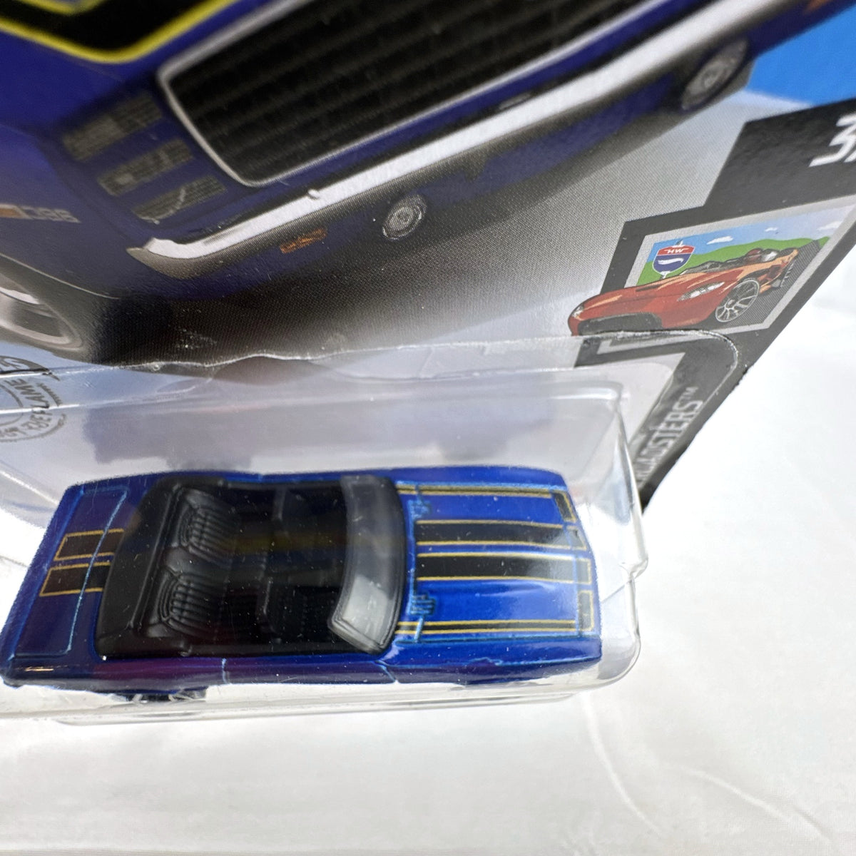 Hot Wheels 1:64 scale 1969 Chevrolet Camaro SS Convertible in deep blue with black and gold racing stripes on original card