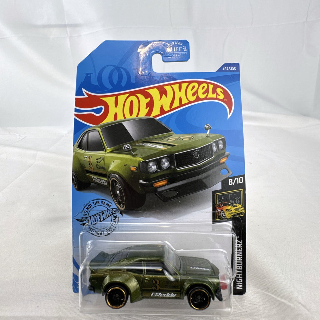 Hot Wheels 1:64 scale Mazda RX-3 diecast car in metallic olive green with GReddy graphics on blister card