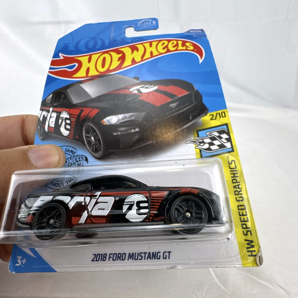 Sealed Hot Wheels 2018 Ford Mustang GT diecast car in black with red stripes and Borla graphics in blister pack