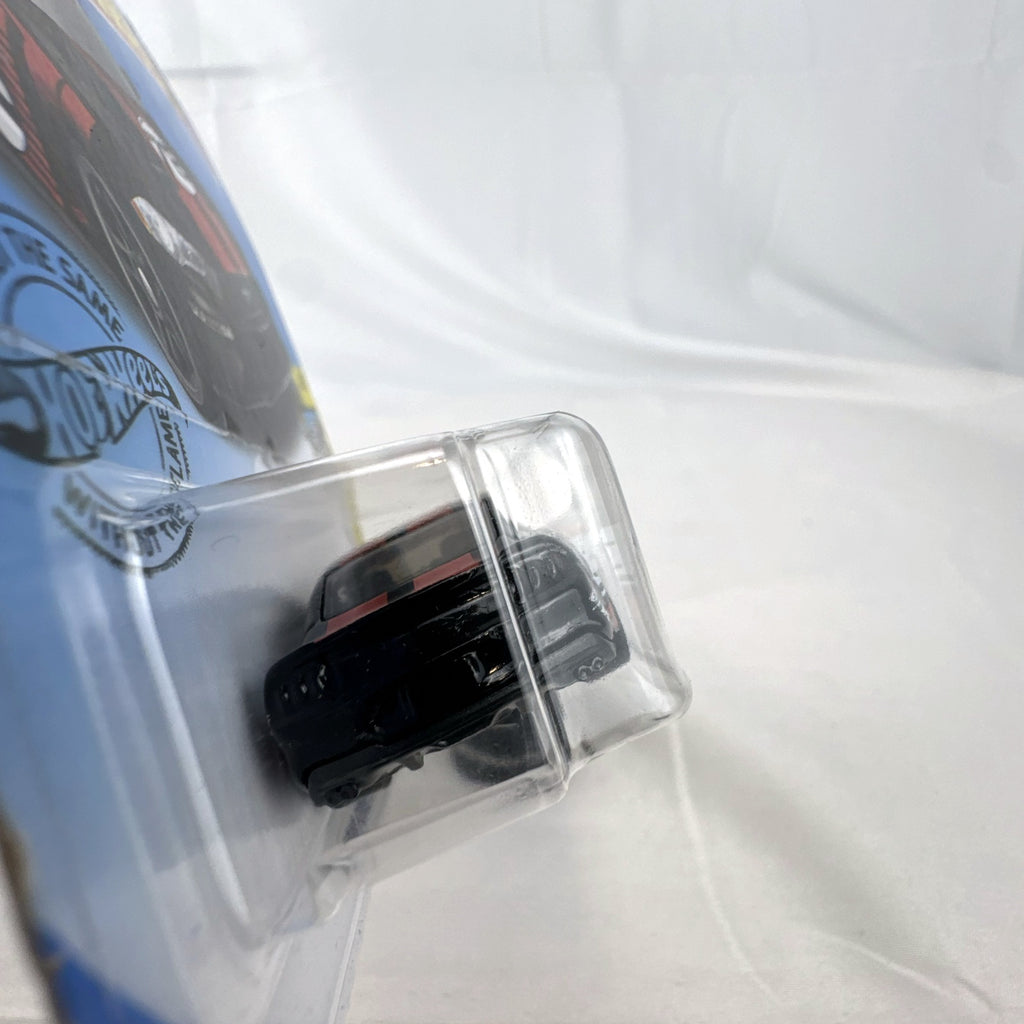 Sealed Hot Wheels 2018 Ford Mustang GT diecast car in black with red stripes and Borla graphics in blister pack