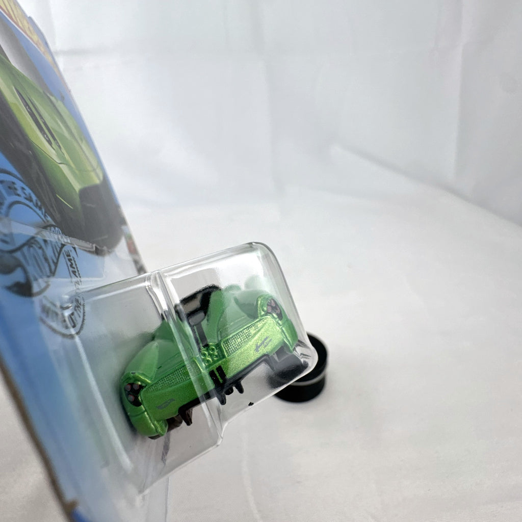 Sealed Hot Wheels 2017 Pagani Huayra Roadster 1:64 diecast car in metallic lime green on original blister card.