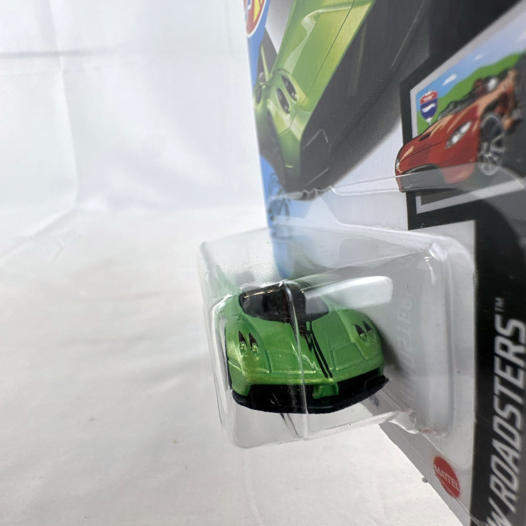 Sealed Hot Wheels 2017 Pagani Huayra Roadster 1:64 diecast car in metallic lime green on original blister card.