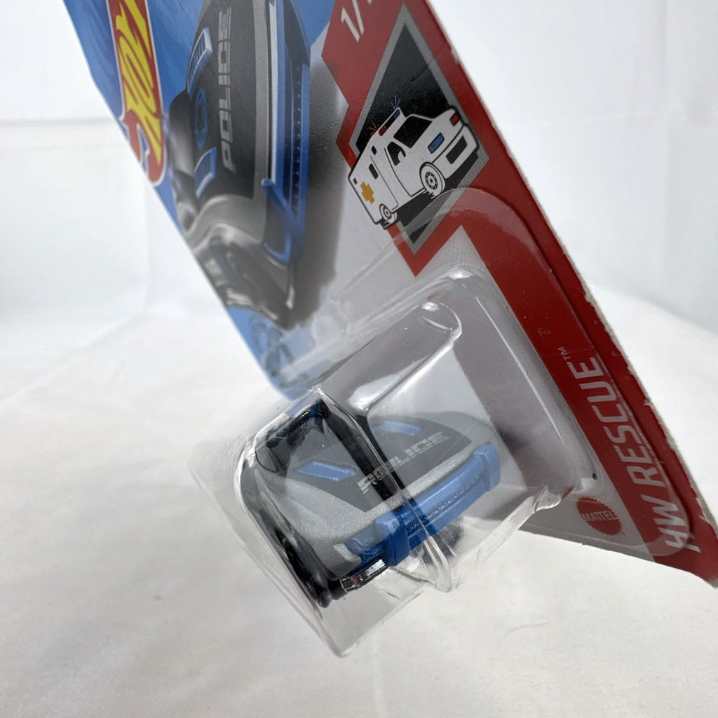 Hot Wheels 1:64 scale Alpha Pursuit police car diecast vehicle sealed on HW Rescue card packaging.