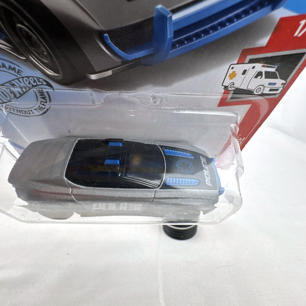 Hot Wheels 1:64 scale Alpha Pursuit police car diecast vehicle sealed on HW Rescue card packaging.