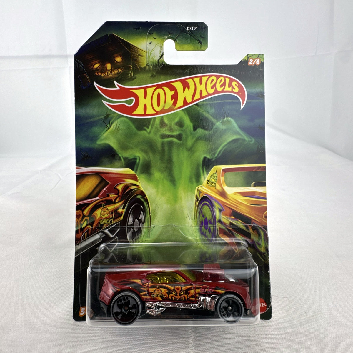 Hot Wheels 1:64 scale Twinduction Halloween Series metallic red diecast muscle car in original sealed packaging.