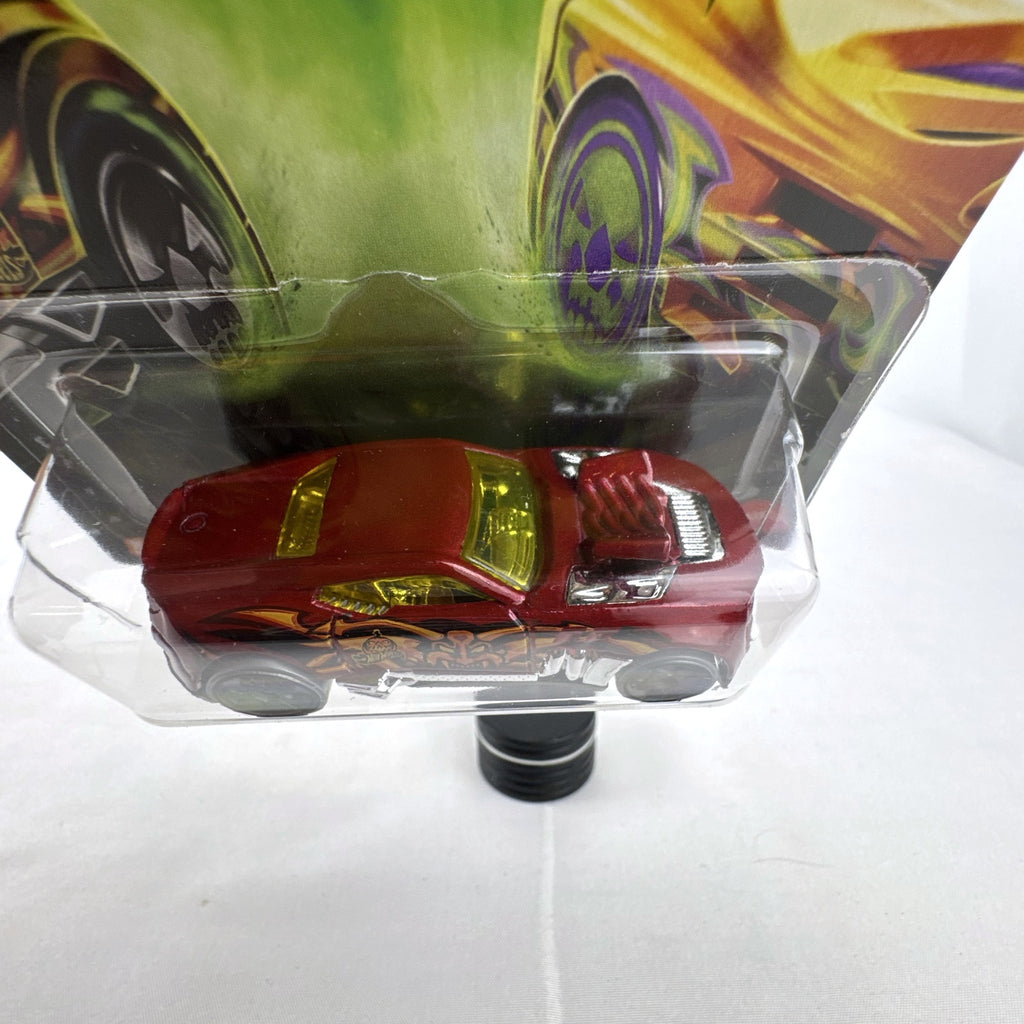 Hot Wheels 1:64 scale Twinduction Halloween Series metallic red diecast muscle car in original sealed packaging.