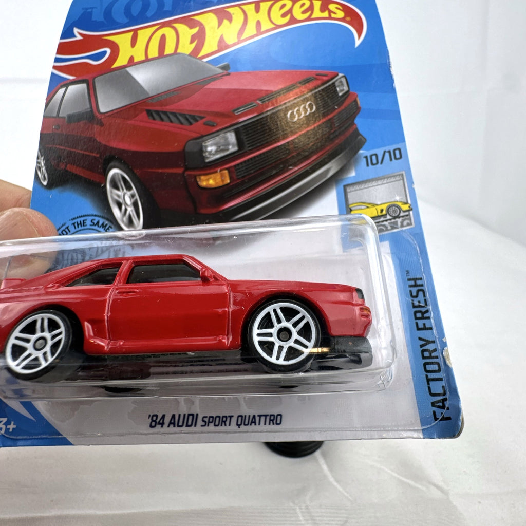 Hot Wheels 1:64 scale '84 Audi Sport Quattro diecast car in factory red sealed on original blister card.