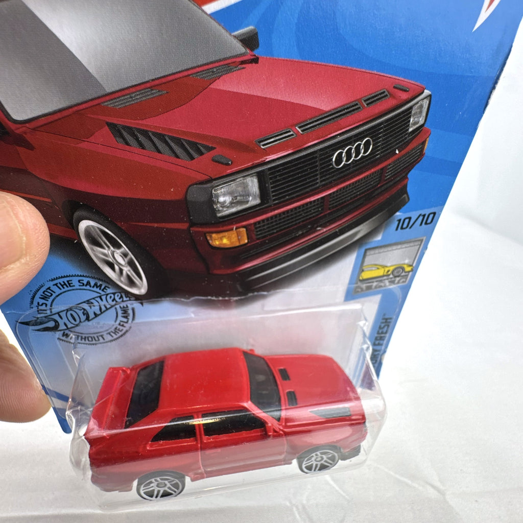Hot Wheels 1:64 scale '84 Audi Sport Quattro diecast car in factory red sealed on original blister card.