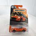 Factory-sealed Matchbox 1:64 scale 2015 Mazda MX-5 Miata diecast model car in metallic orange on original blister card
