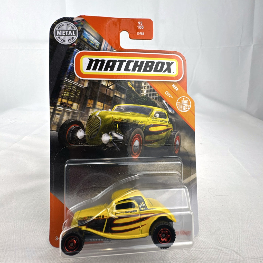 Matchbox 1:64 scale 1933 Ford Coupe Hot Rod diecast vehicle in yellow Mooneyes flame livery sealed on card