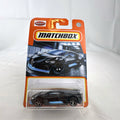 Matchbox 1:64 scale Bugatti Divo diecast car in matte black with blue accents on original card packaging