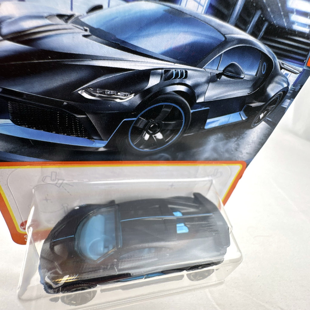 Matchbox 1:64 scale Bugatti Divo diecast car in matte black with blue accents on original card packaging