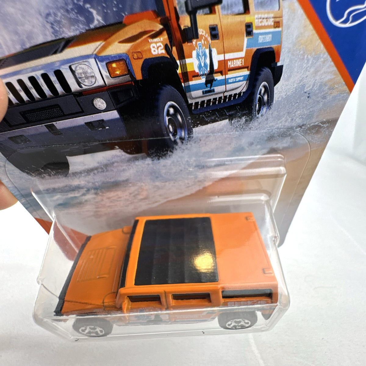 Matchbox 1:72 scale Hummer H2 SUV Concept diecast vehicle in orange MBX Coastal Marine Rescue graphics packaging.