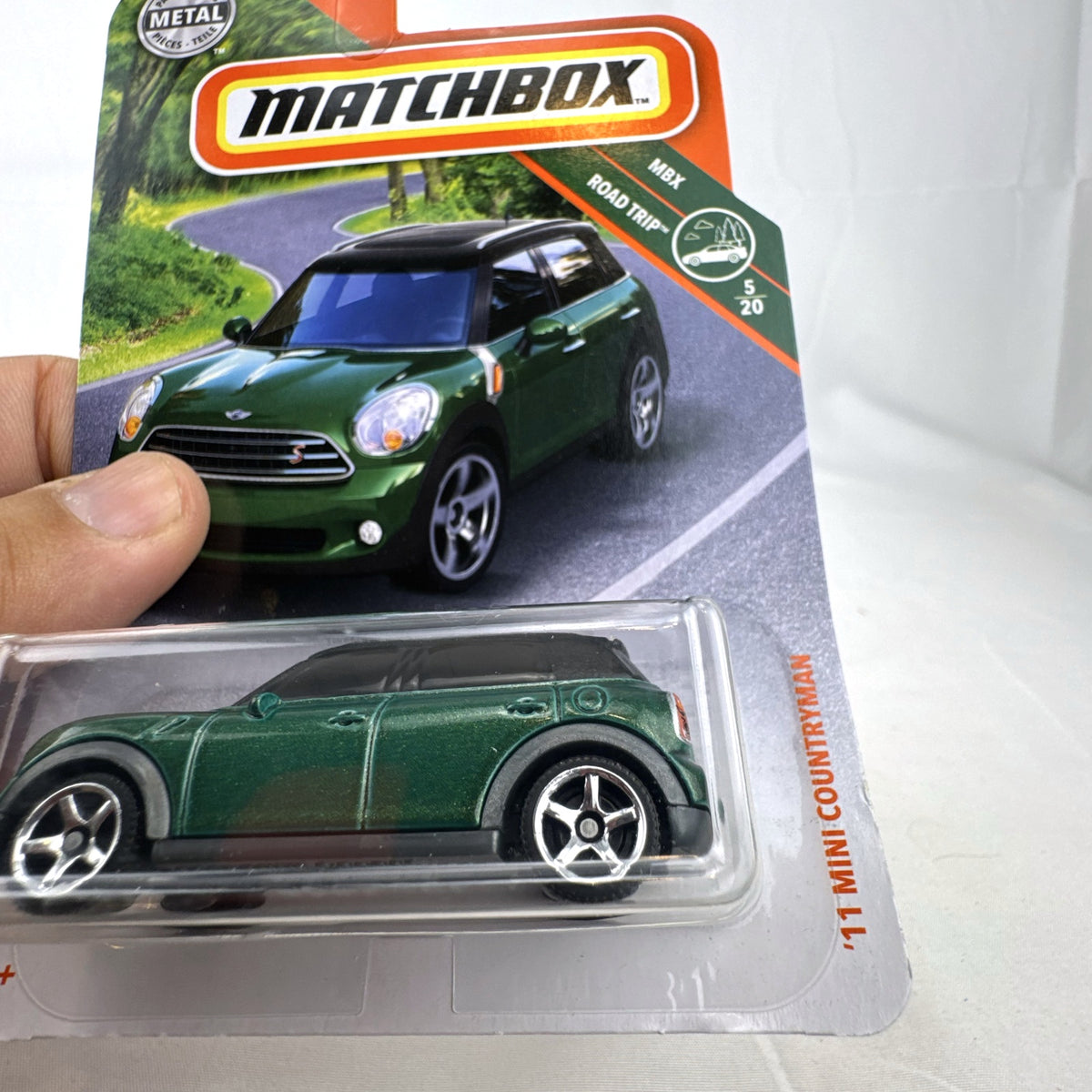 Matchbox 2011 MINI Cooper Countryman 1:64 scale diecast car in metallic green, factory sealed on card.