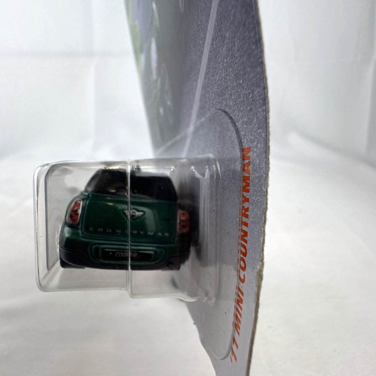 Matchbox 2011 MINI Cooper Countryman 1:64 scale diecast car in metallic green, factory sealed on card.