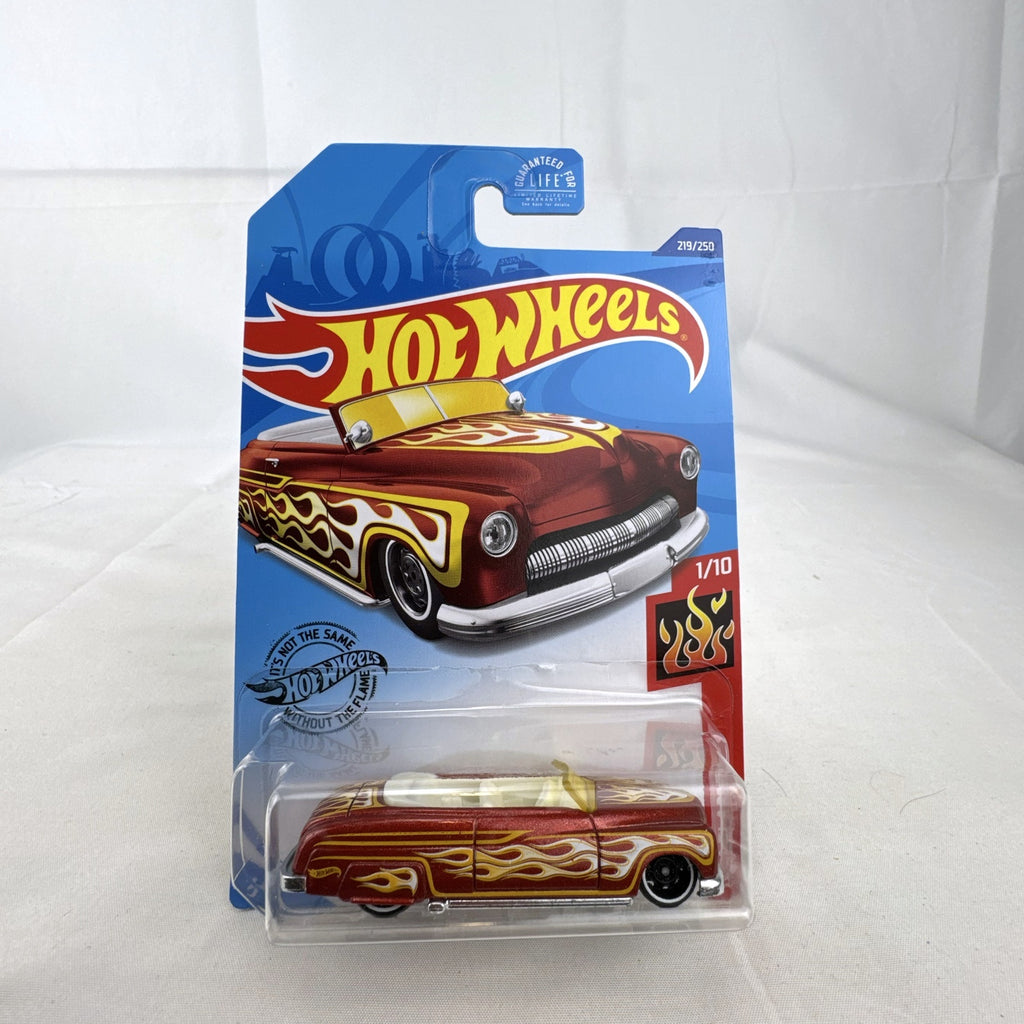 Hot Wheels 1:64 scale '49 Merc diecast convertible in metallic red with yellow and white flame graphics, sealed on card.