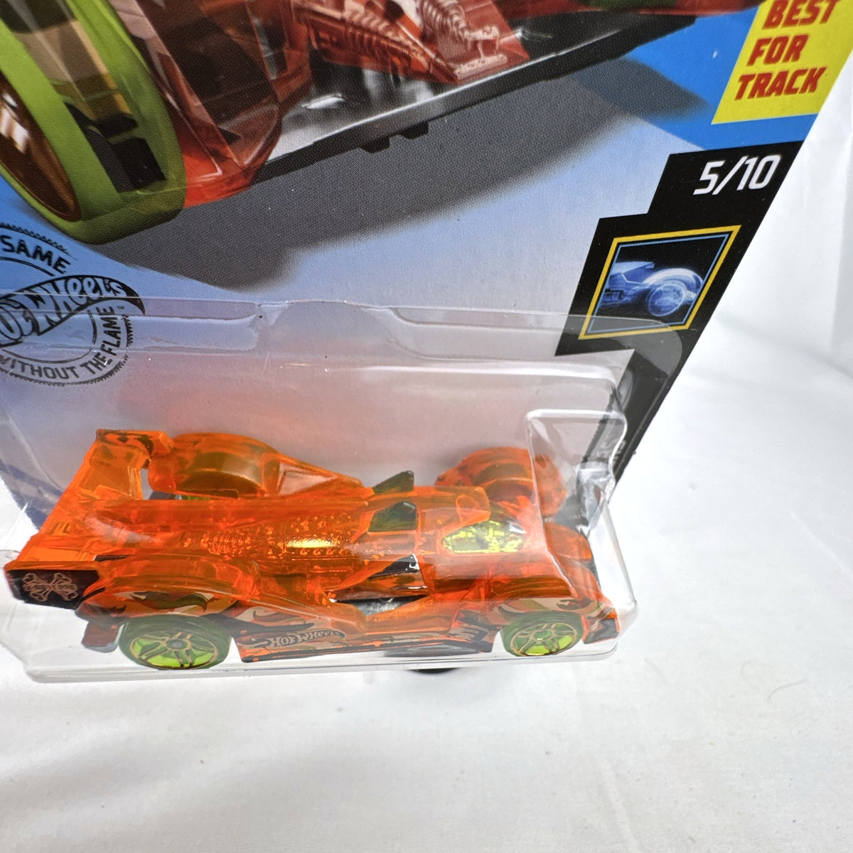 Hot Wheels 1:64 scale Hi-Tech Missile diecast car in translucent orange X-Raycers packaging.