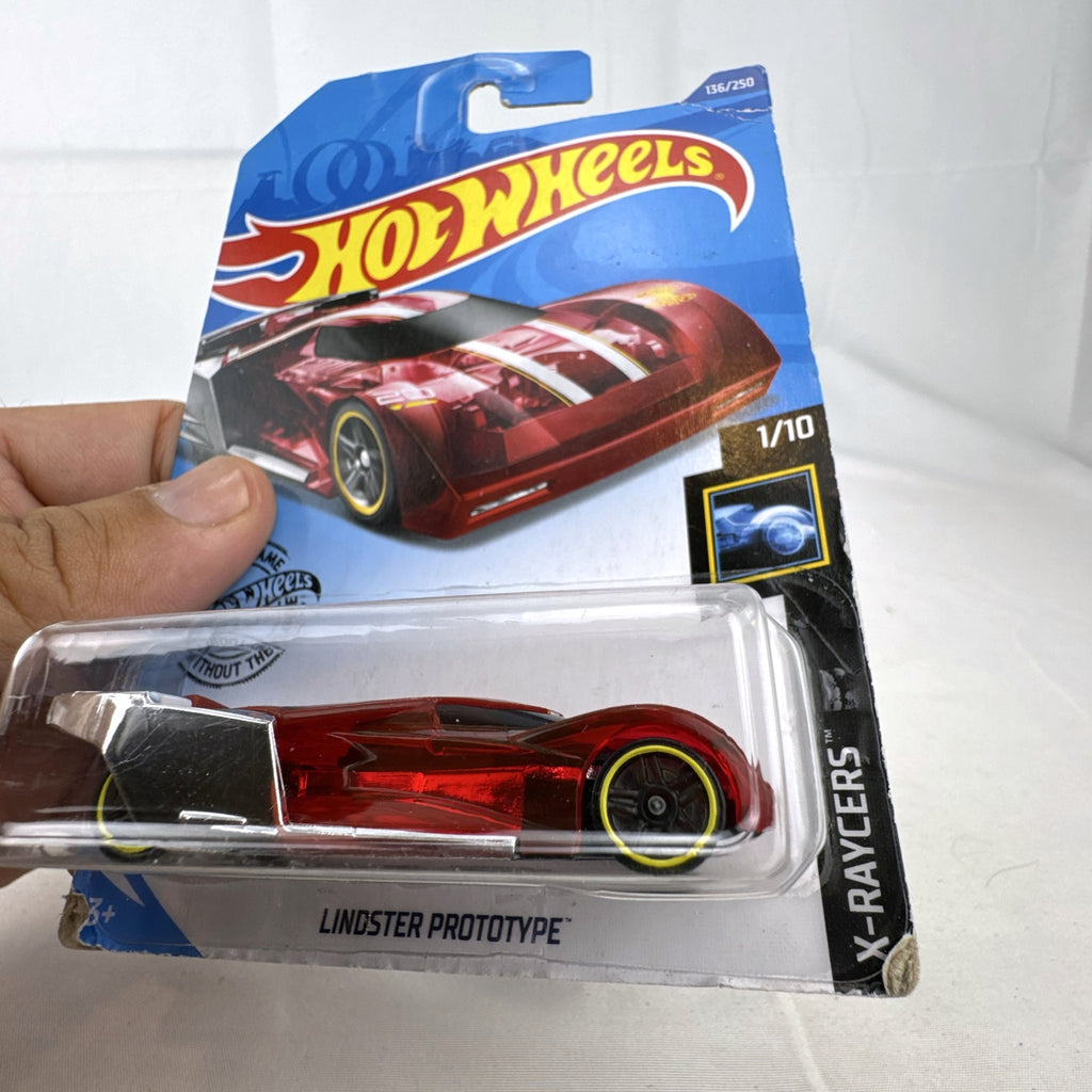 Hot Wheels Lindster Prototype 1:64 scale diecast car in translucent red sealed on original X-Raycers cardback