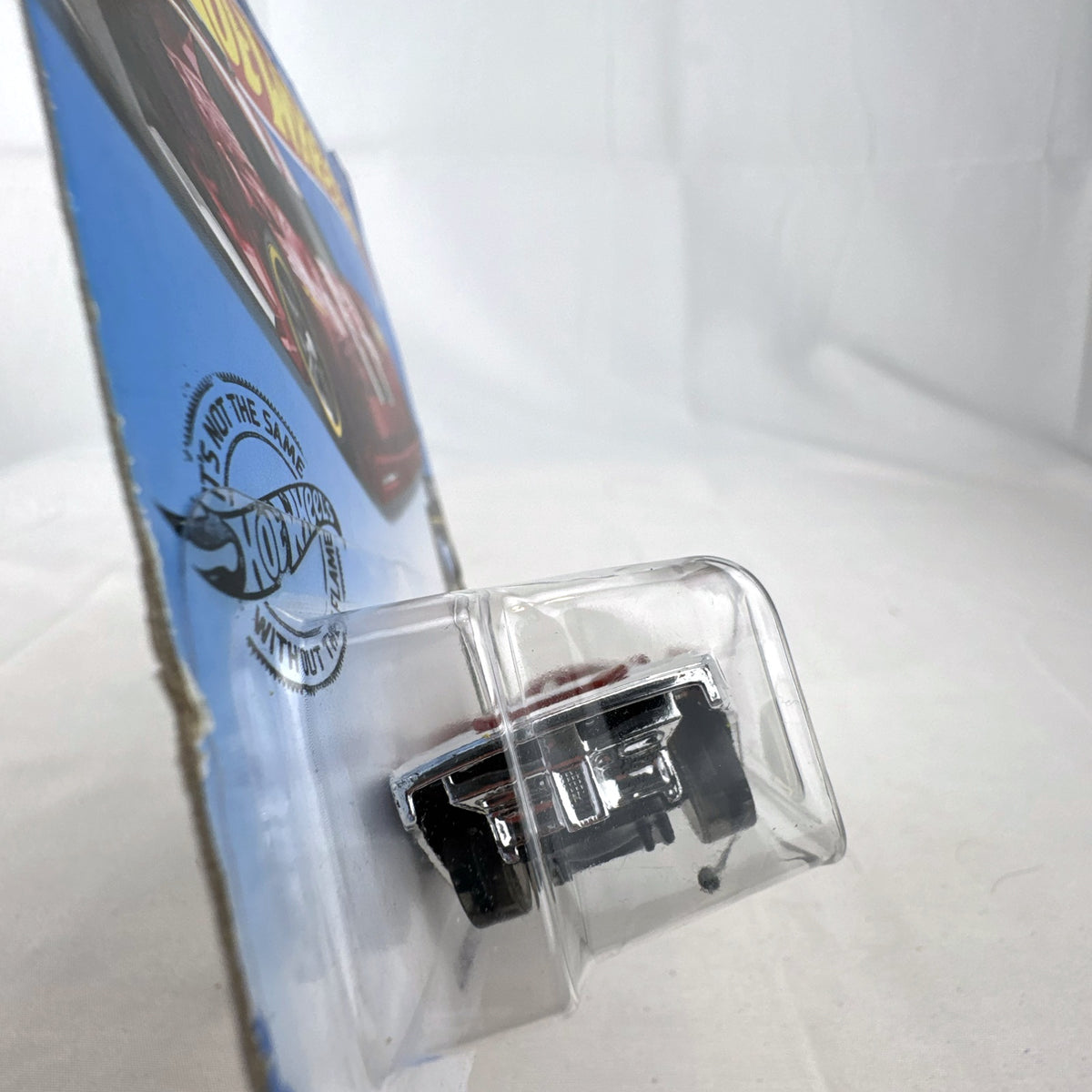 Hot Wheels Lindster Prototype 1:64 scale diecast car in translucent red sealed on original X-Raycers cardback