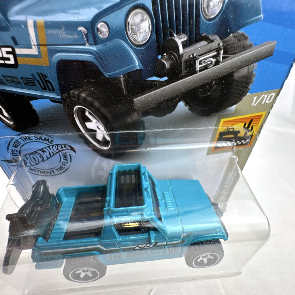 Hot Wheels 1:64 1967 Jeepster Commando diecast truck in metallic blue from the Baja Blazers series