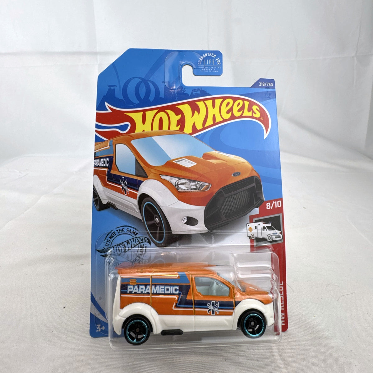 Hot Wheels 1:64 Ford Transit Connect Paramedic Van in orange and blue from the HW Rescue series sealed on card.