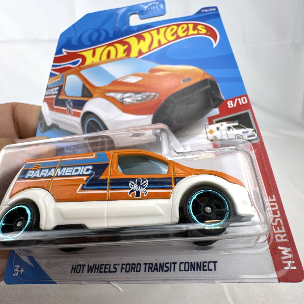 Hot Wheels 1:64 Ford Transit Connect Paramedic Van in orange and blue from the HW Rescue series sealed on card.