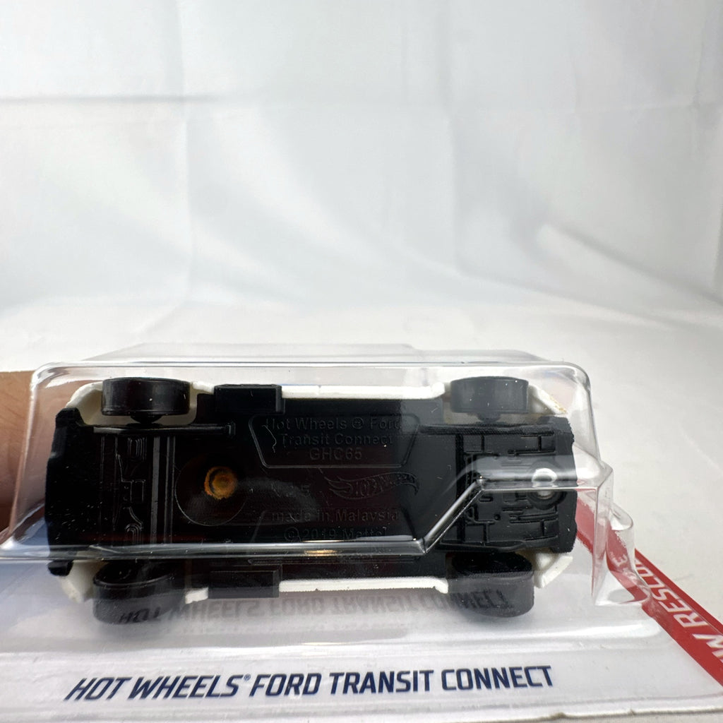 Hot Wheels 1:64 Ford Transit Connect Paramedic Van in orange and blue from the HW Rescue series sealed on card.