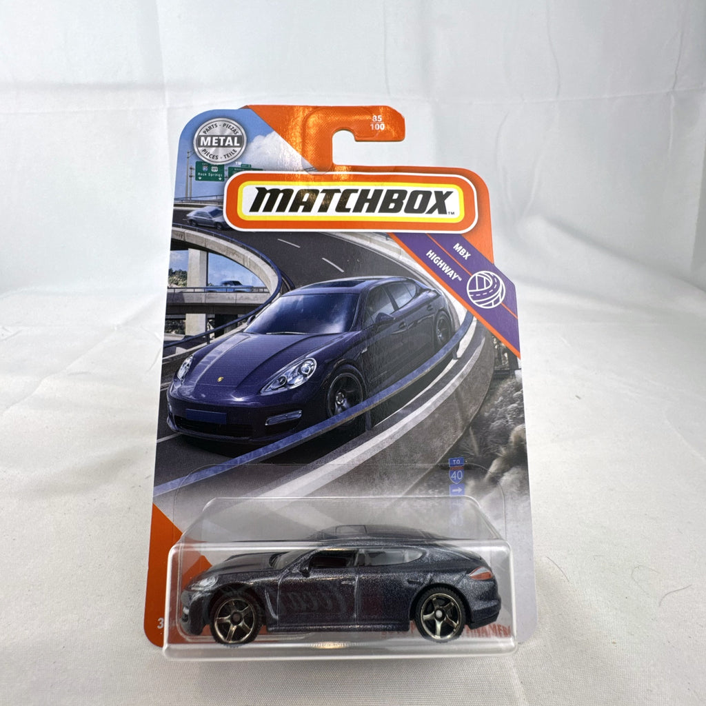 Matchbox MBX Highway 2010 Porsche Panamera diecast car in dark metallic gray on factory sealed card