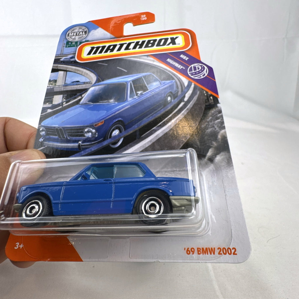 Matchbox 1:64 scale 1969 BMW 2002 diecast car in blue, factory sealed on MBX Highway blister card.