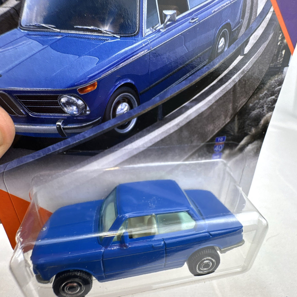 Matchbox 1:64 scale 1969 BMW 2002 diecast car in blue, factory sealed on MBX Highway blister card.