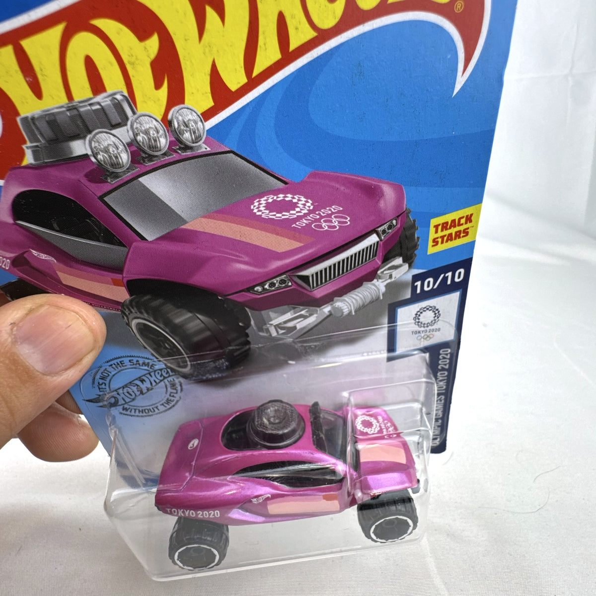 Hot Wheels Dune Daddy 1:64 diecast car in metallic pink with Tokyo 2020 Olympic Games Beach Volleyball graphics