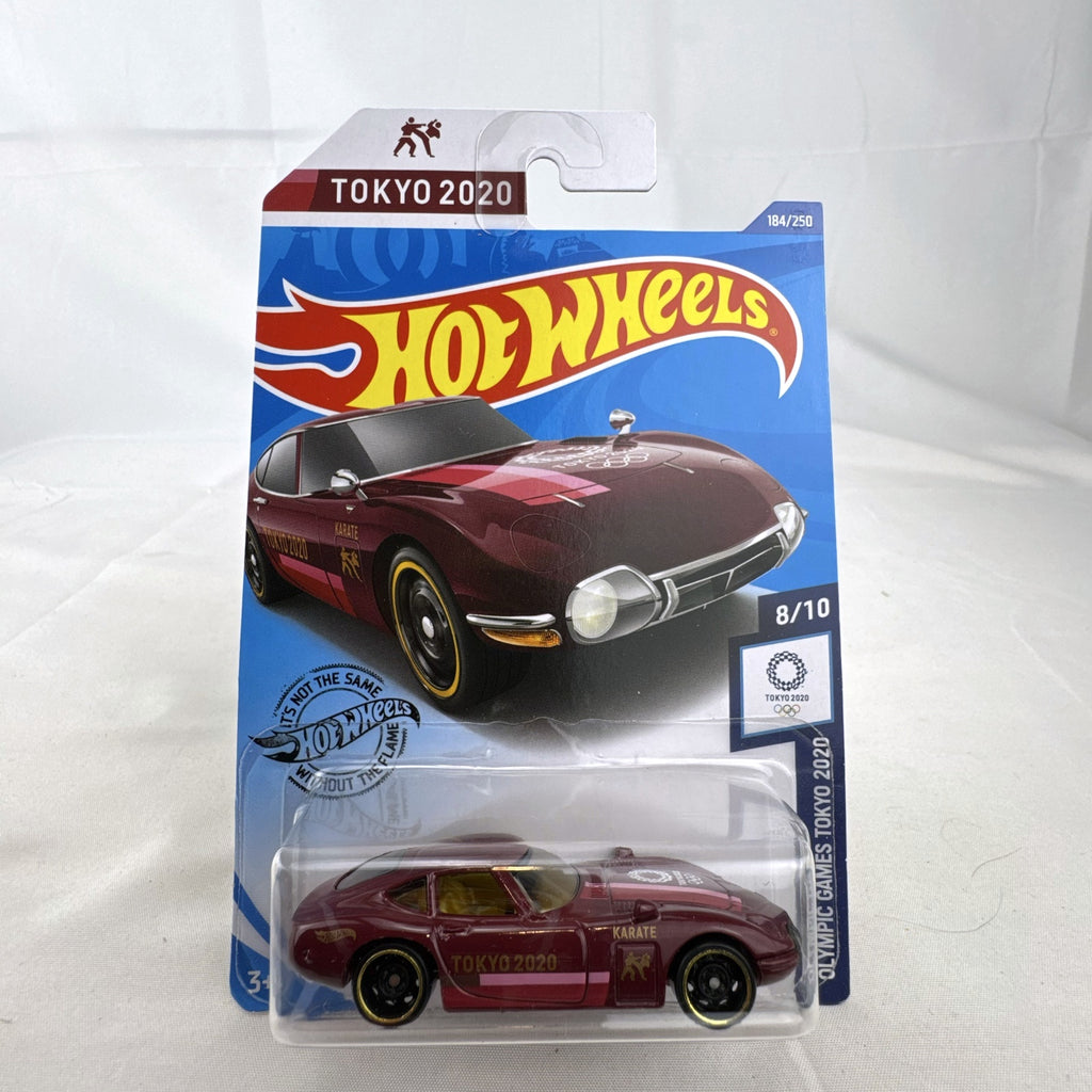 Sealed Hot Wheels 1:64 Toyota 2000 GT Tokyo 2020 Olympic Games Karate edition in deep maroon on original card.