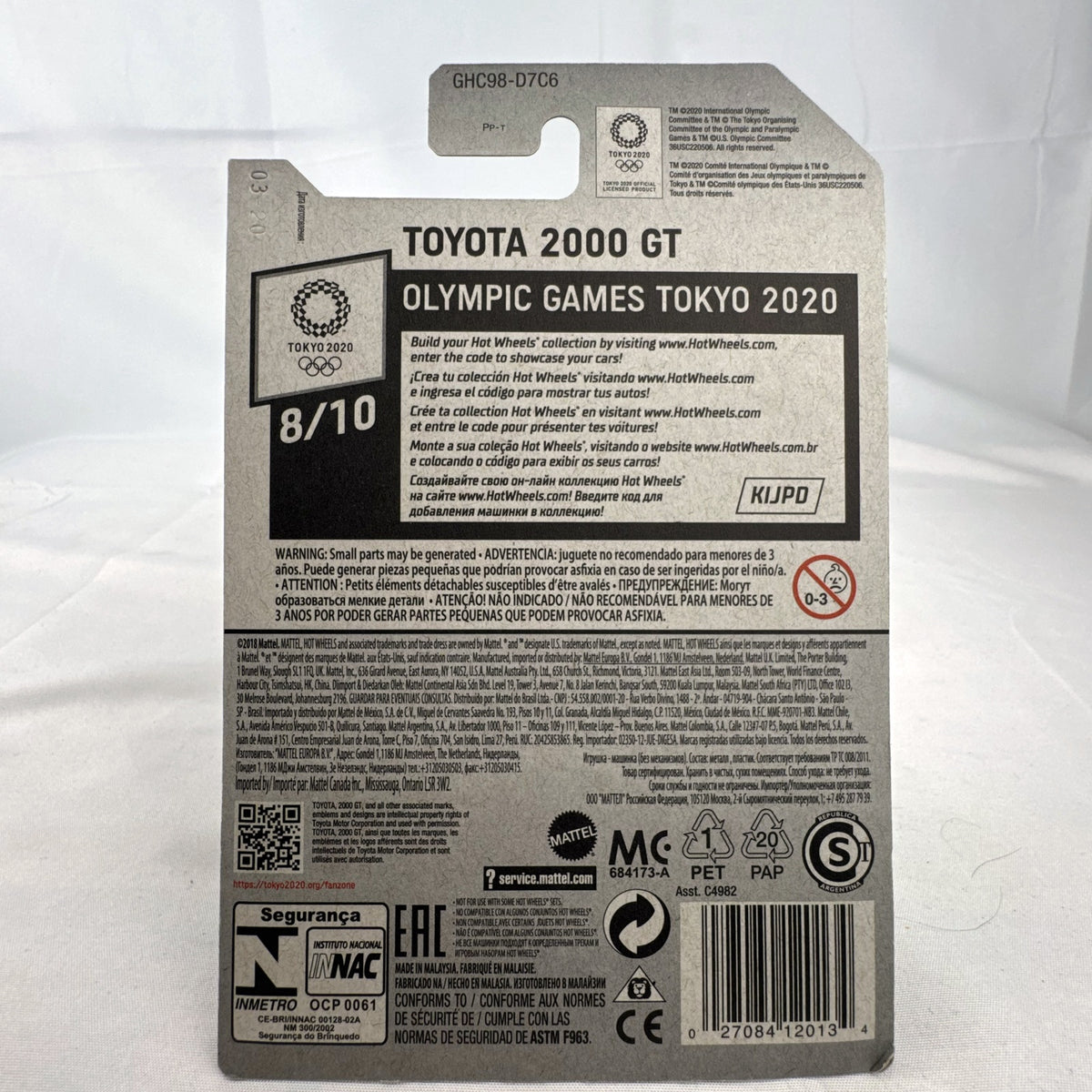 Sealed Hot Wheels 1:64 Toyota 2000 GT Tokyo 2020 Olympic Games Karate edition in deep maroon on original card.