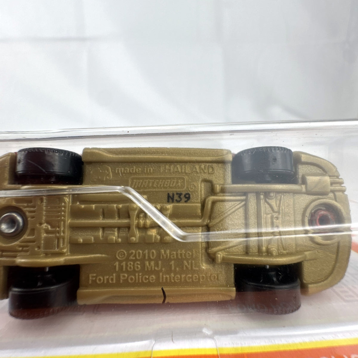 Matchbox 1:64 scale Ford Police Interceptor Fire Chief diecast car in original red packaging with gold push bumper.
