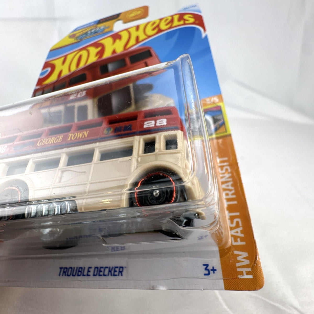 Hot Wheels Trouble Decker 1:64 scale diecast double decker bus in tan and red sealed in original package.