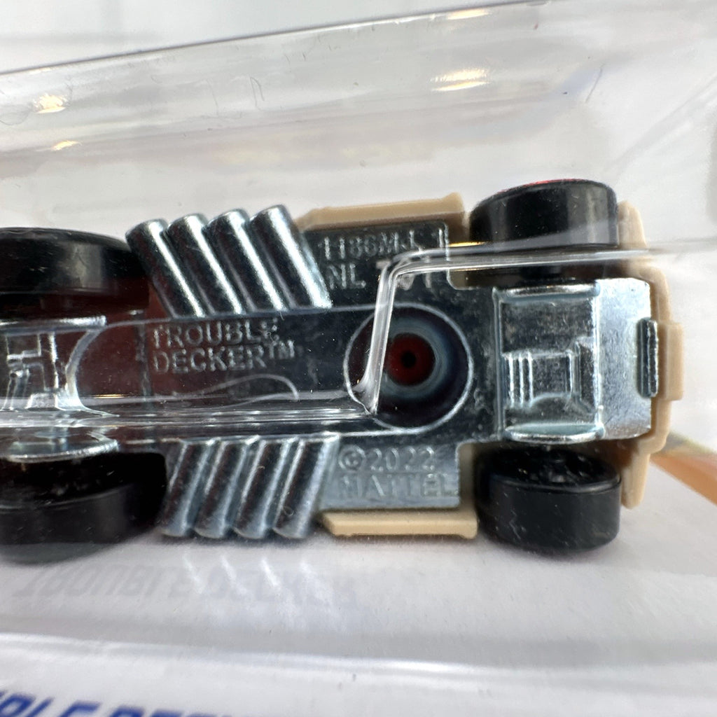 Hot Wheels Trouble Decker 1:64 scale diecast double decker bus in tan and red sealed in original package.