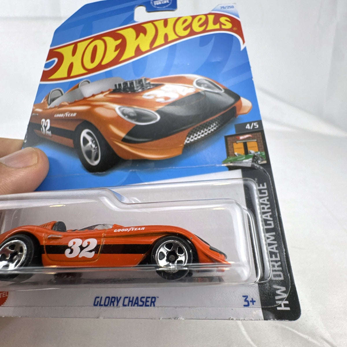 Hot Wheels Glory Chaser 1:64 scale diecast car in orange Goodyear racing livery sealed on original card.