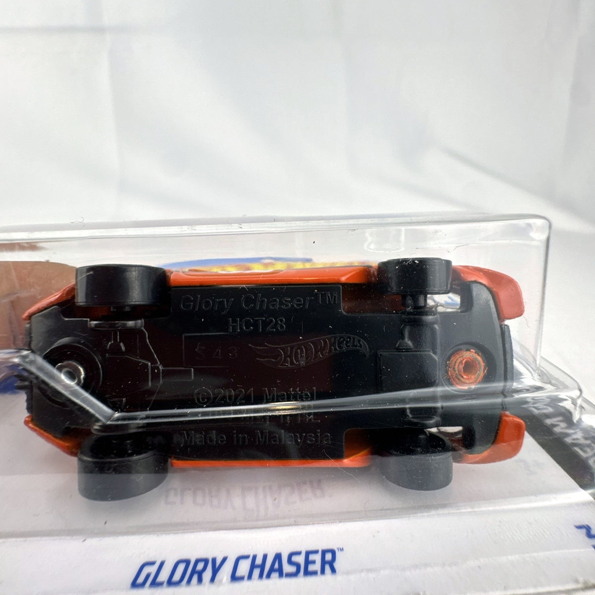 Hot Wheels Glory Chaser 1:64 scale diecast car in orange Goodyear racing livery sealed on original card.