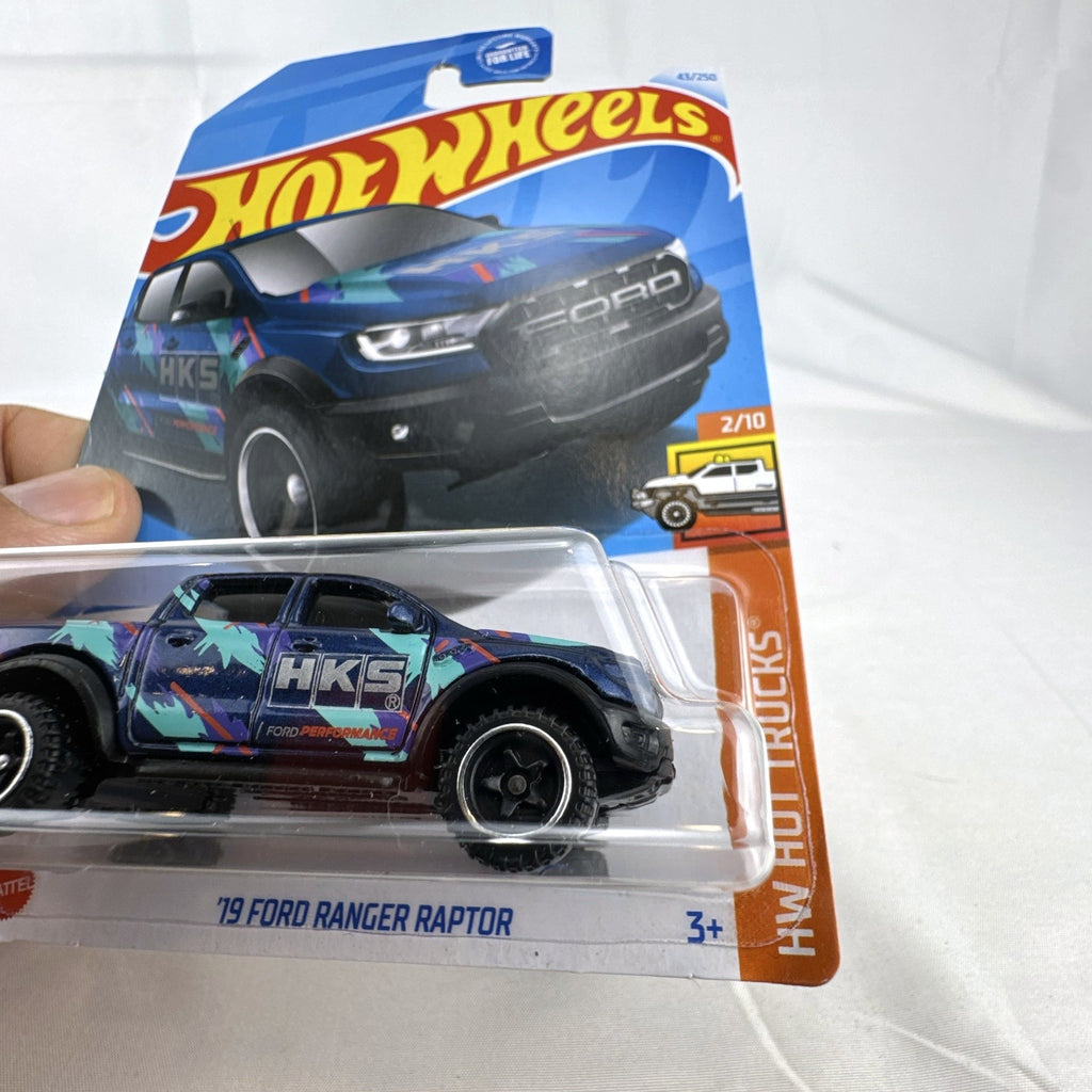 Hot Wheels 2019 Ford Ranger Raptor 1:64 diecast truck in dark blue with HKS livery sealed on original card.