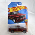 Hot Wheels 1:64 1963 Studebaker Champ diecast pickup truck in dark red metallic on original sealed card