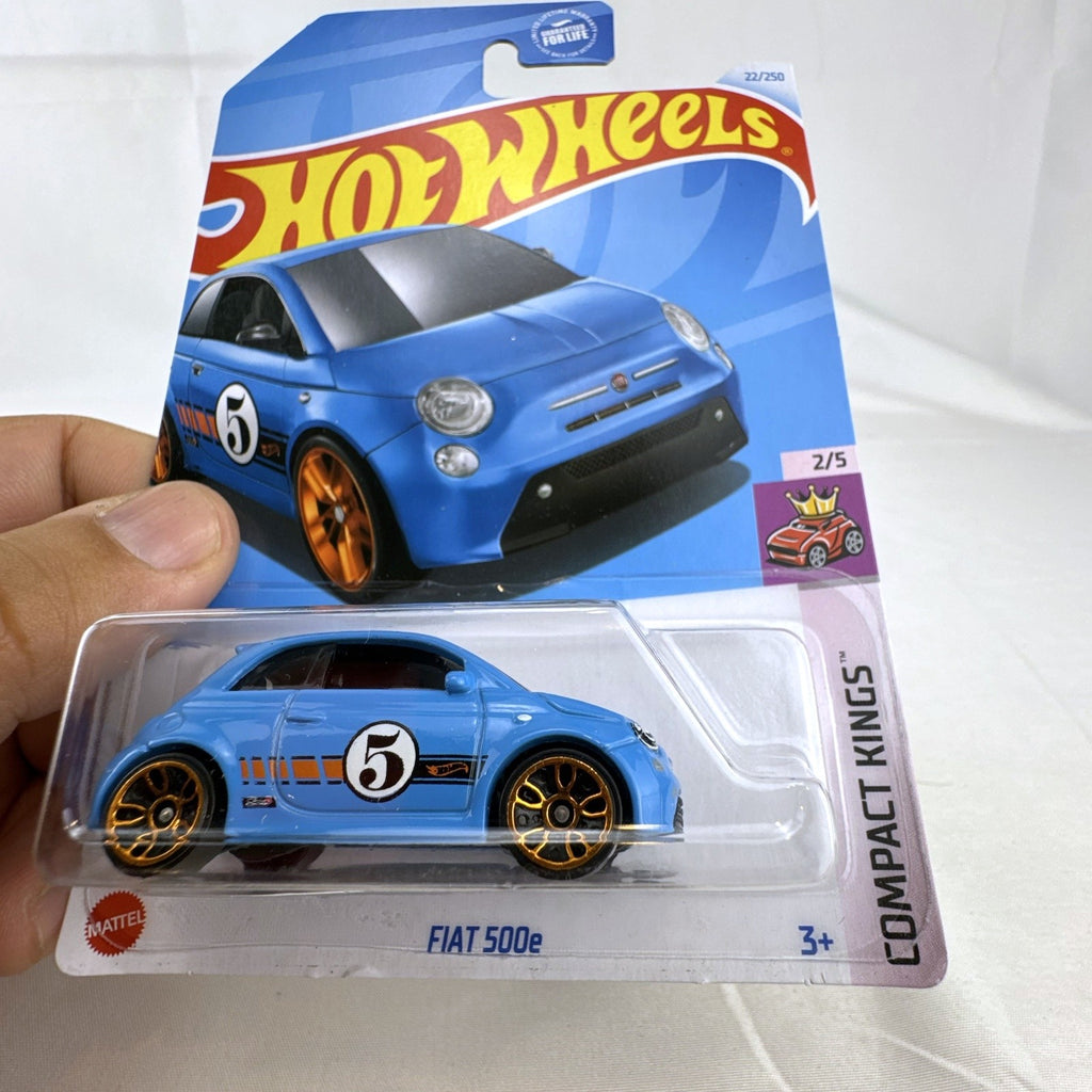 Hot Wheels 1:64 scale diecast Fiat 500e in light blue with racing graphics, sealed on card.