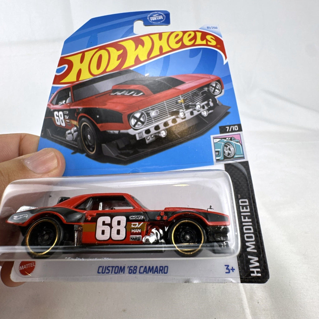 Hot Wheels Custom '68 Chevy Camaro diecast car in red and black livery, factory sealed on original card