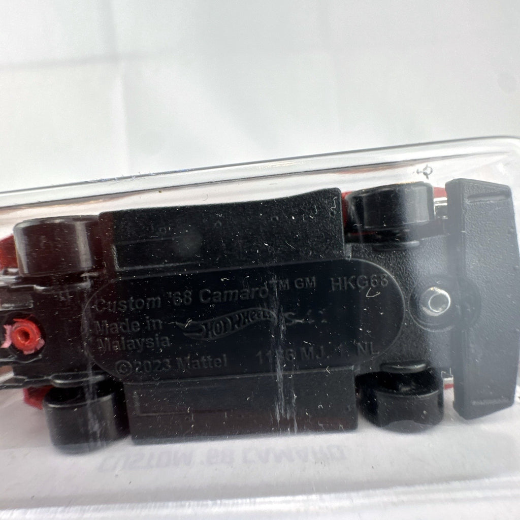Hot Wheels Custom '68 Chevy Camaro diecast car in red and black livery, factory sealed on original card