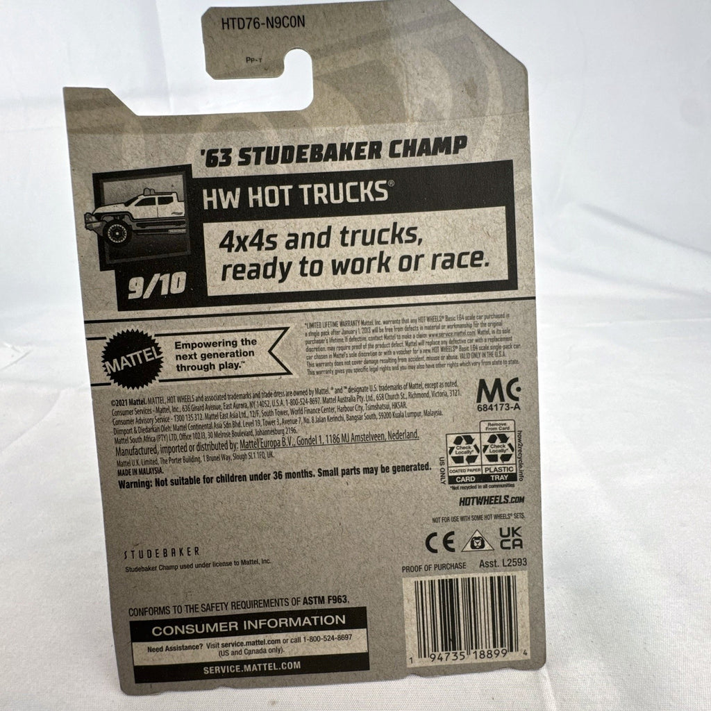 Hot Wheels 1:64 scale 1963 Studebaker Champ pickup truck in white with teal side graphics, sealed in original package.