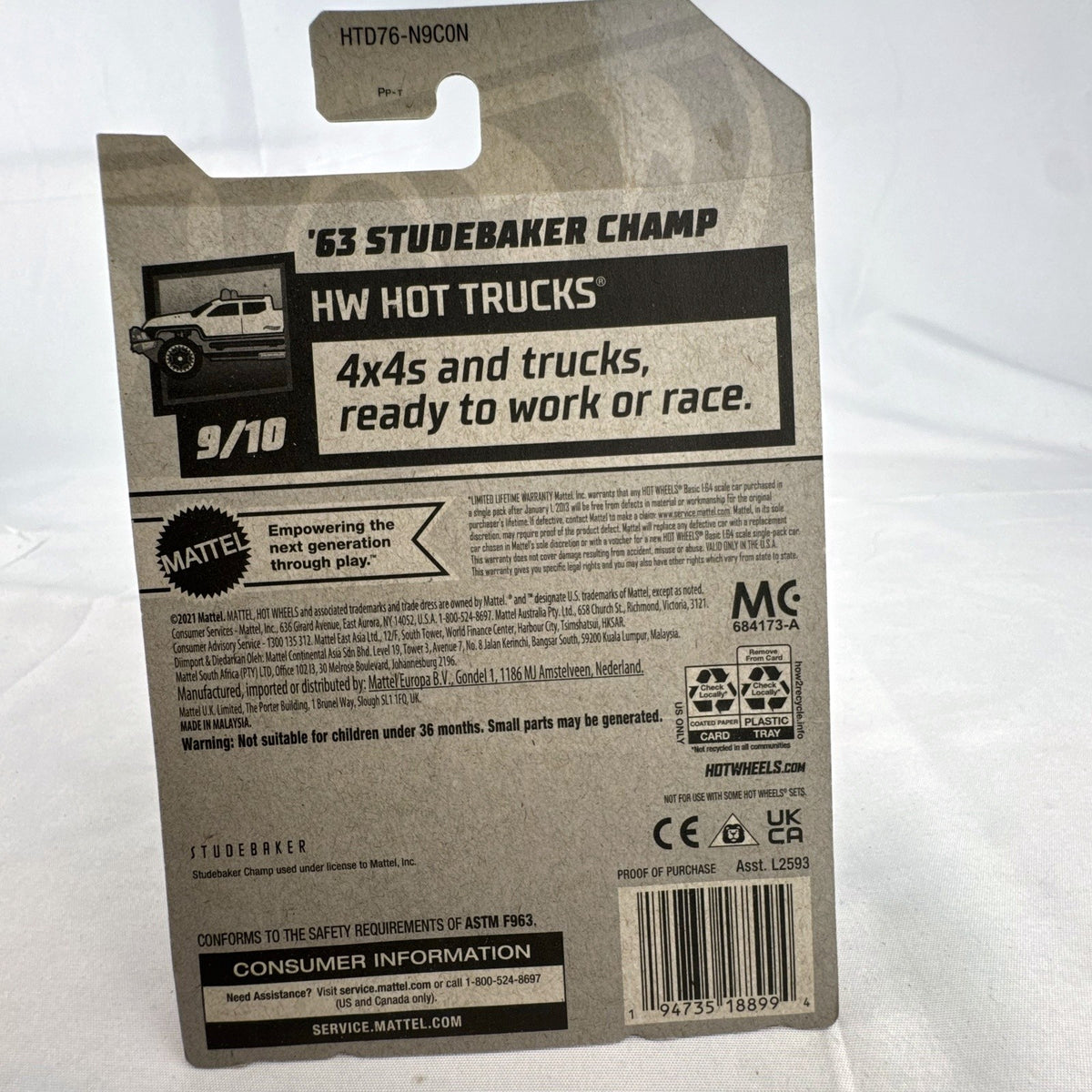 Hot Wheels 1:64 scale 1963 Studebaker Champ pickup truck in white with teal side graphics, sealed in original package.