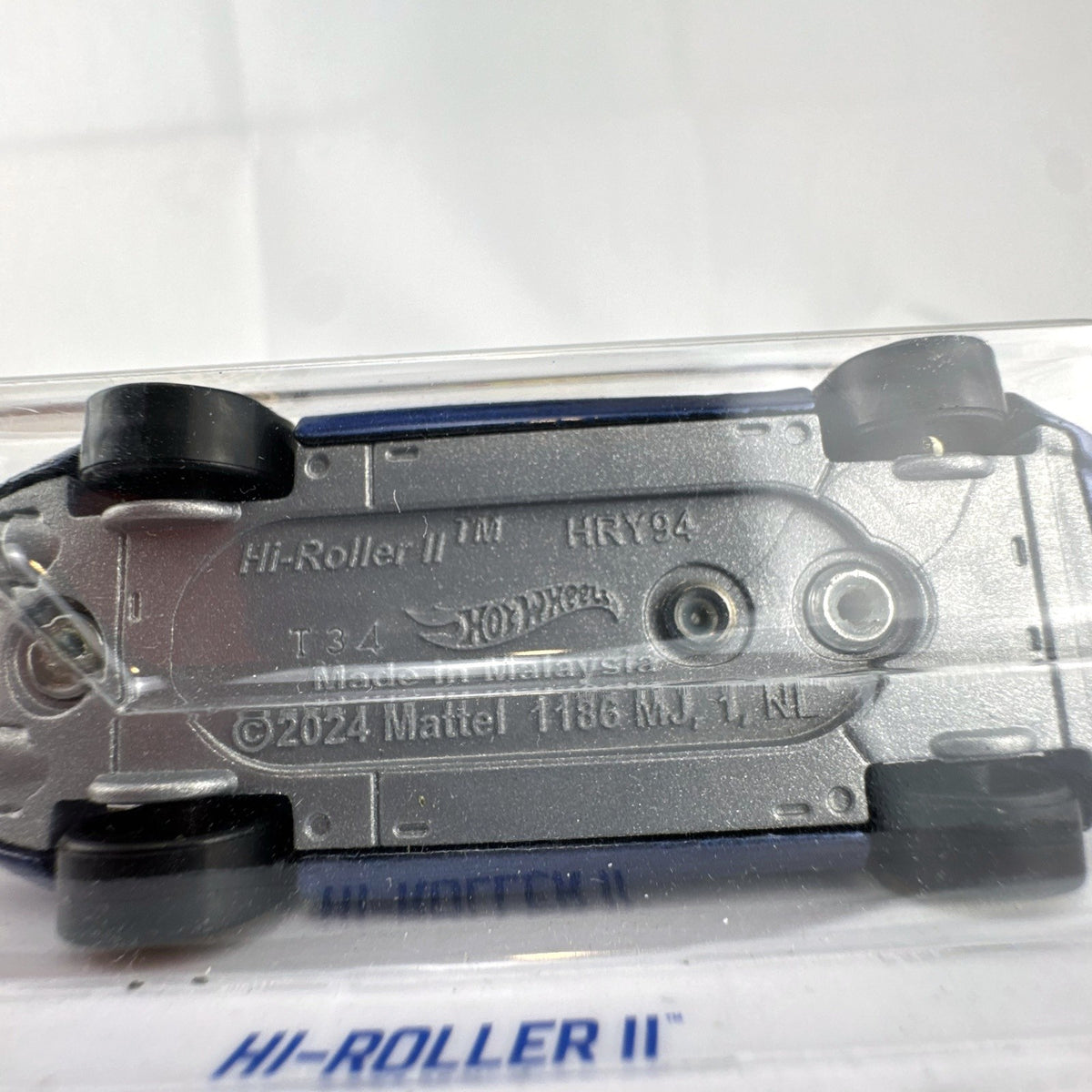 Hot Wheels 1:64 scale Hi-Roller II diecast car in metallic blue from the 2024 HW Rolling Metal series, factory sealed