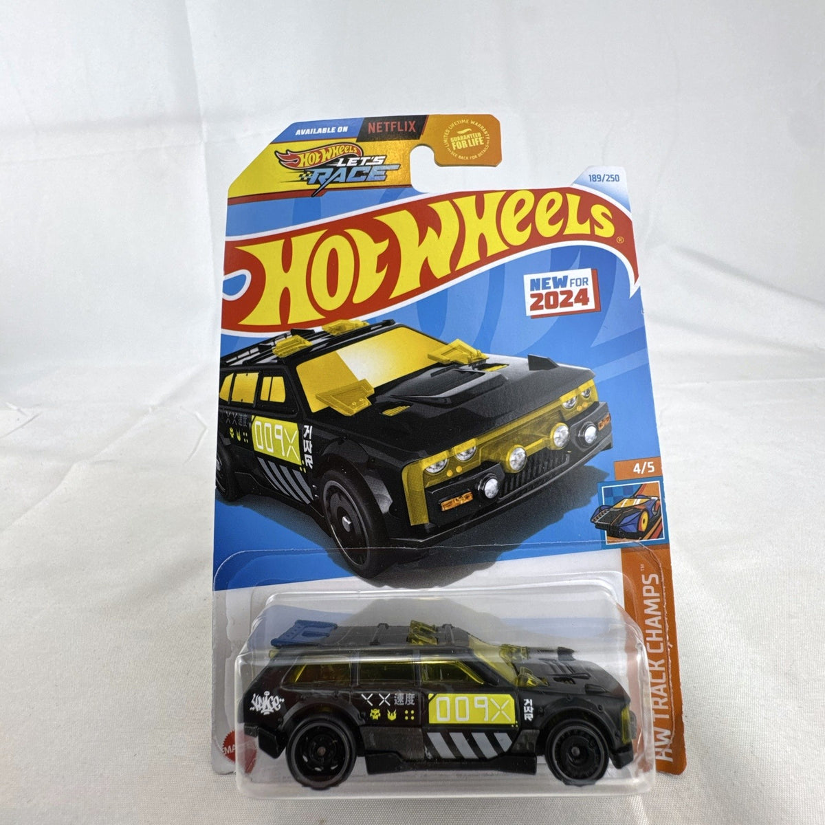 Hot Wheels 1:64 scale Track Dwagon diecast car in matte black, factory sealed on HW Track Champs cardback