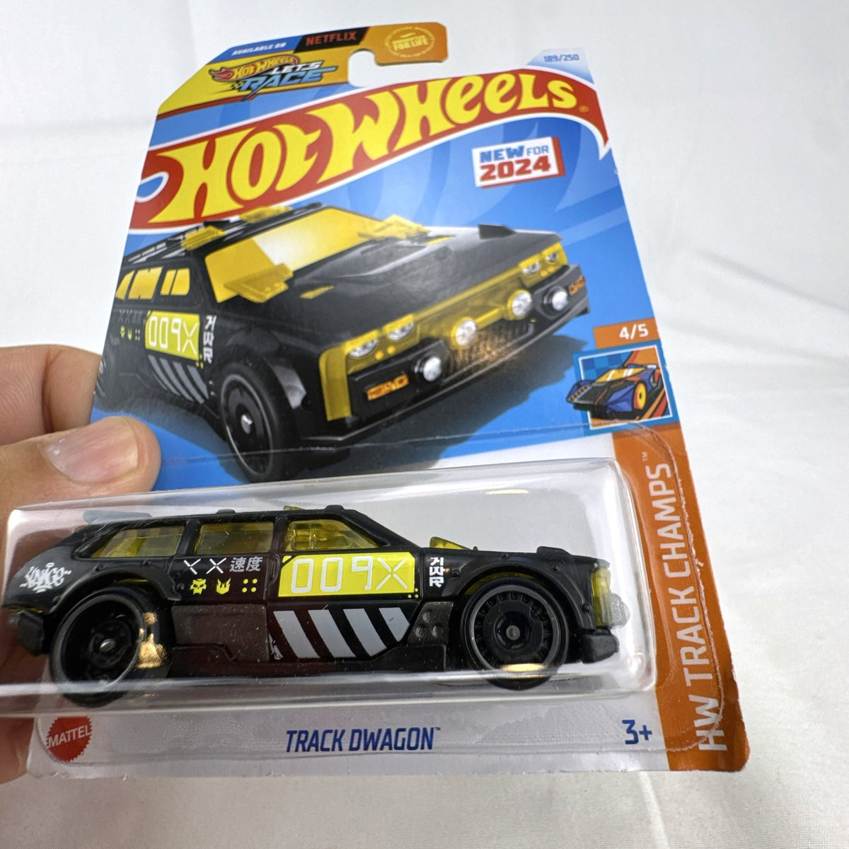Hot Wheels 1:64 scale Track Dwagon diecast car in matte black, factory sealed on HW Track Champs cardback
