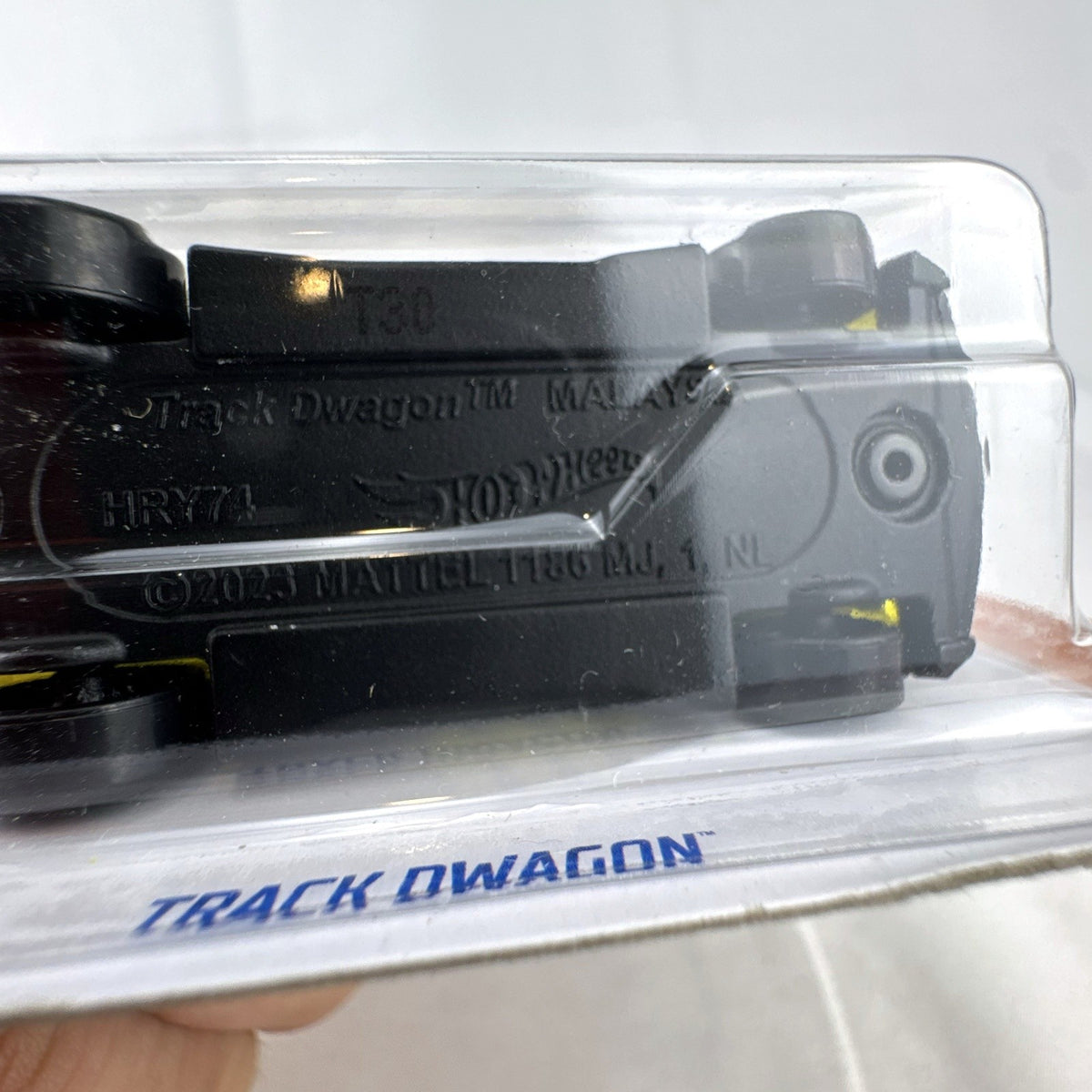 Hot Wheels 1:64 scale Track Dwagon diecast car in matte black, factory sealed on HW Track Champs cardback